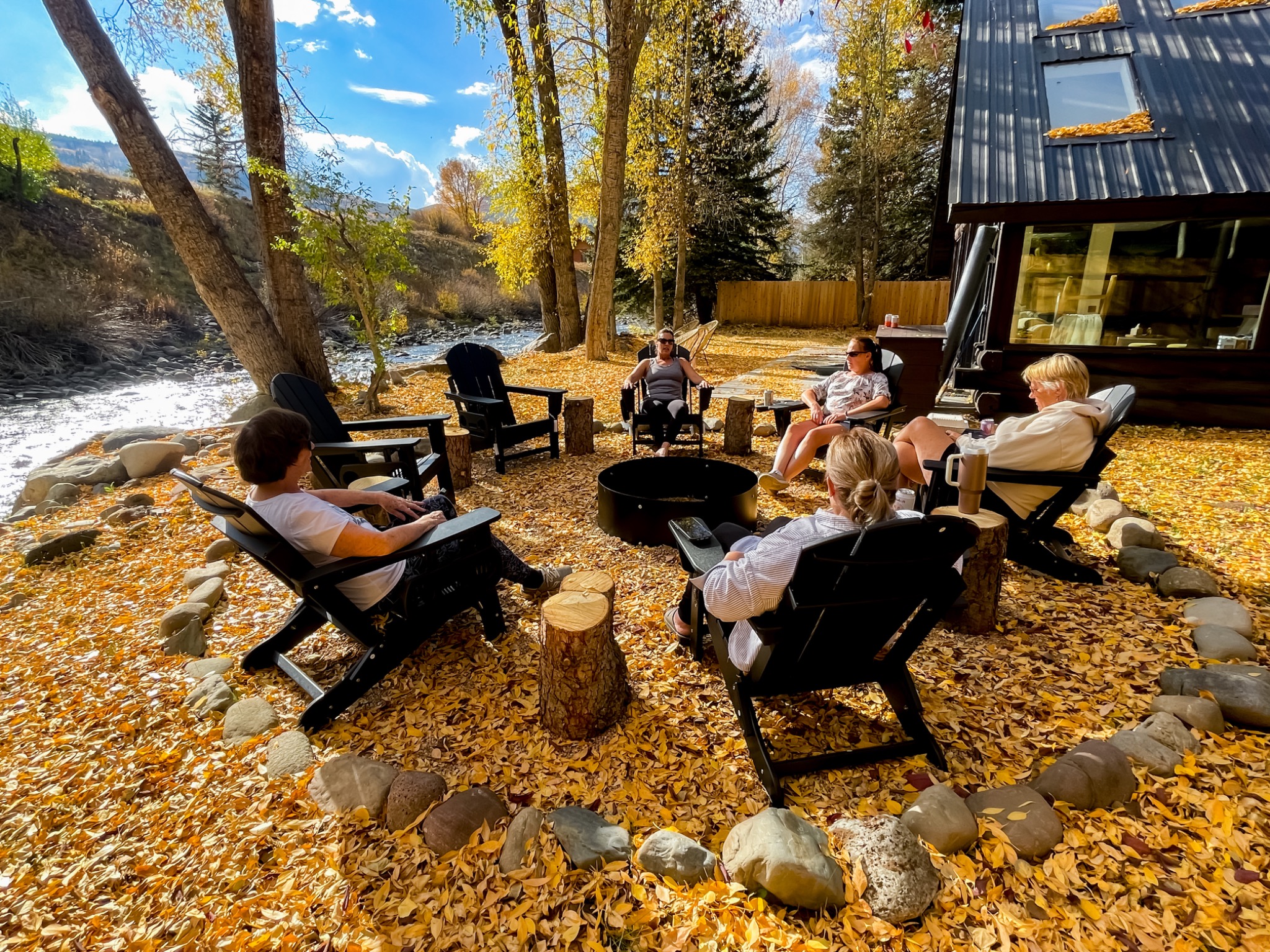 Friends gathered at riverfront fire pit