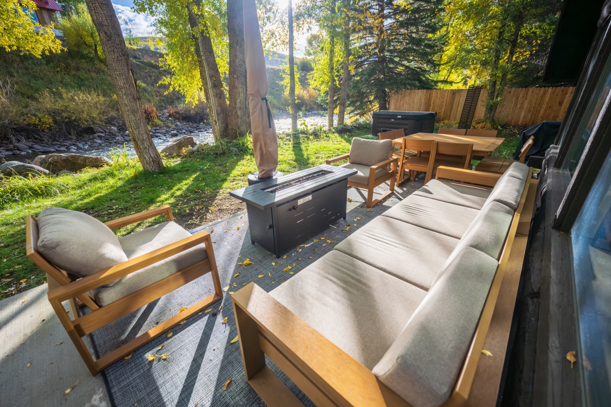 Main cabin living room with river-facing windows
